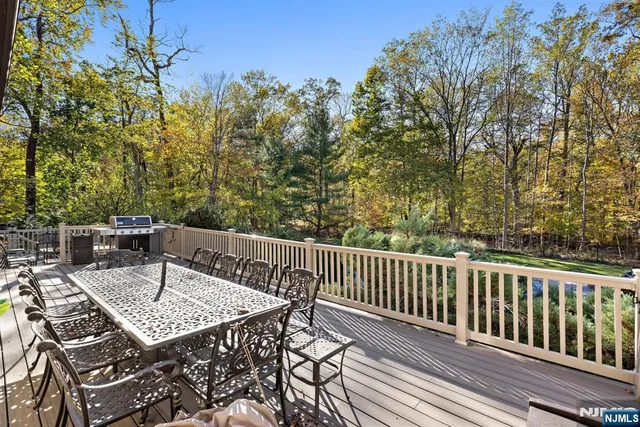 a view of a table and chairs on the roof deck