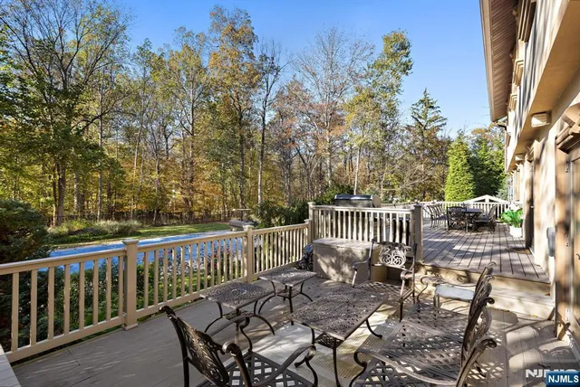a view of a chairs and table on the deck