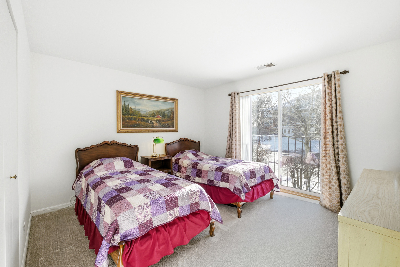 815 Leicester Road, Unit 109 Elk Grove Village, IL 60007 - Photo 19 of 31 a bedroom with two beds and a large window