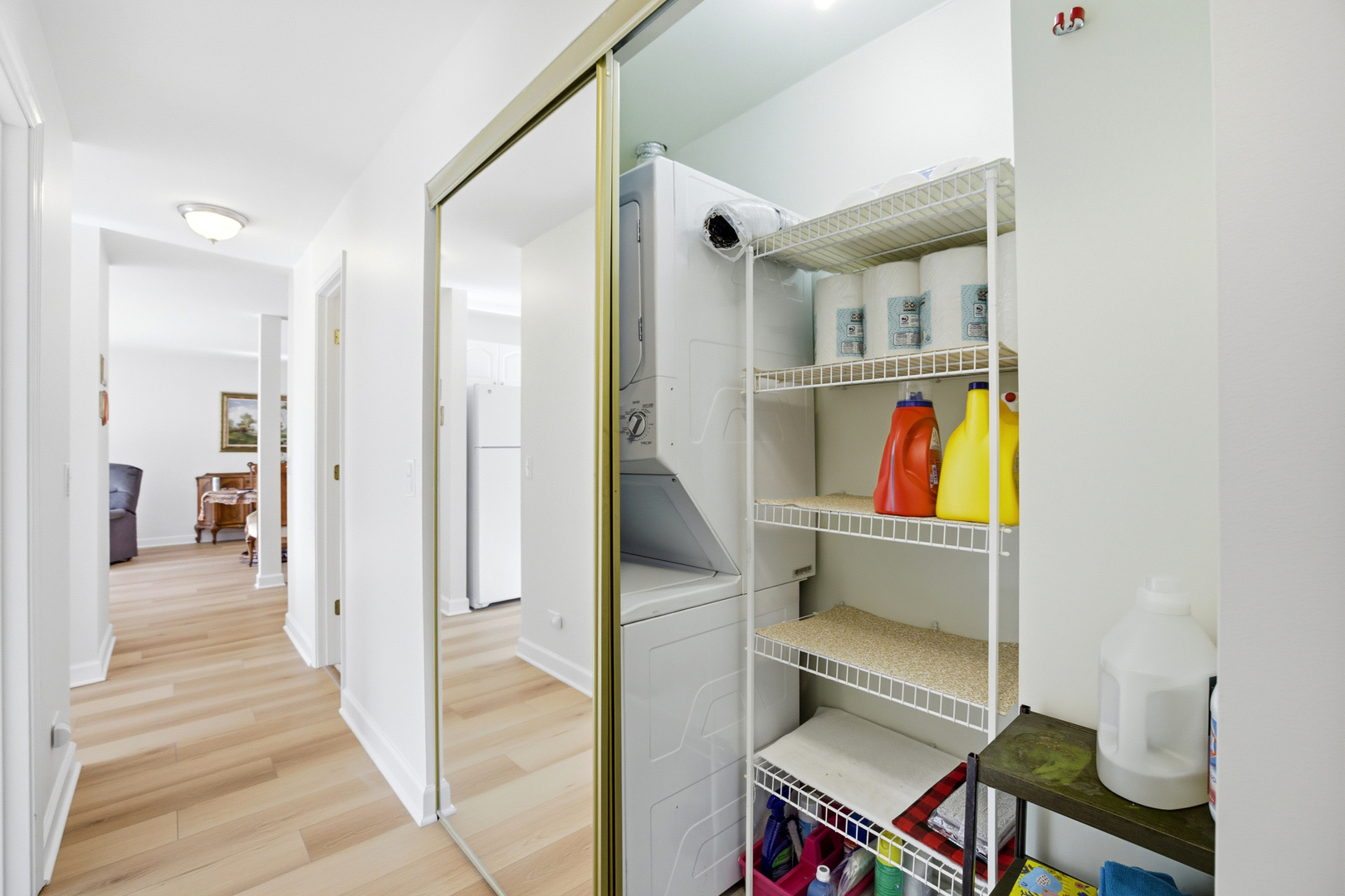 815 Leicester Road, Unit 109 Elk Grove Village, IL 60007 - Photo 23 of 31 a room with wooden floor and furniture