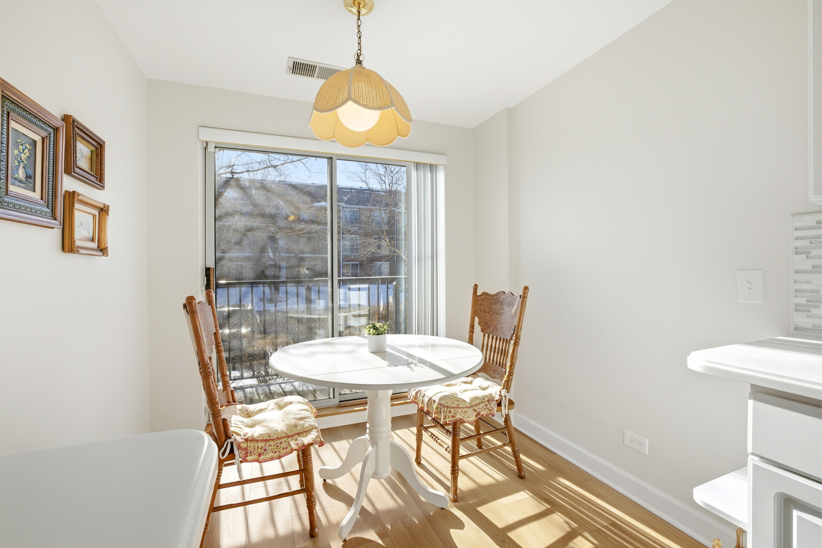 815 Leicester Road, Unit 109 Elk Grove Village, IL 60007 - Photo 5 of 31 a view of a dining room with furniture and a chandelier