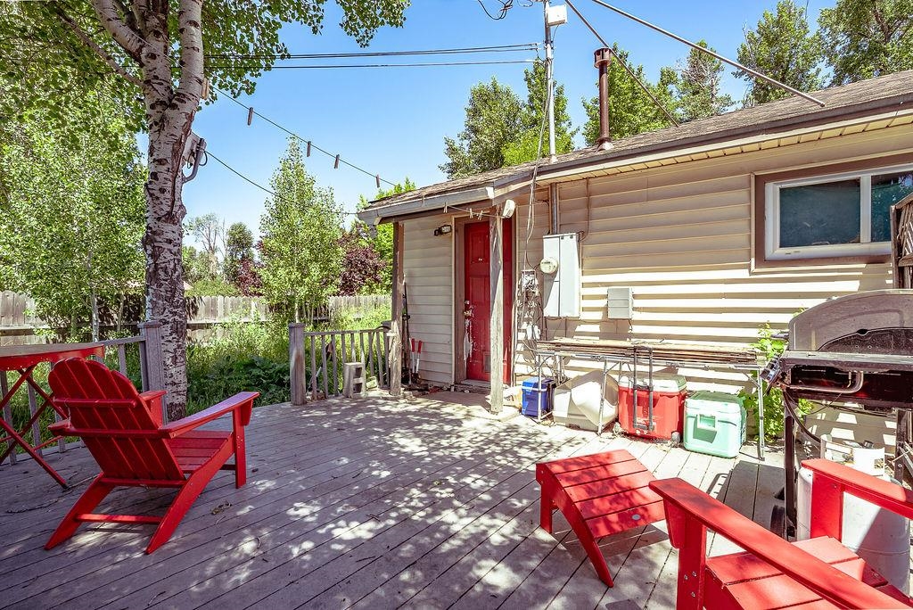 470 Riverside Avenue Chester, CA 96020 - Photo 24 of 25 a view of a patio with a table chairs and a fire pit