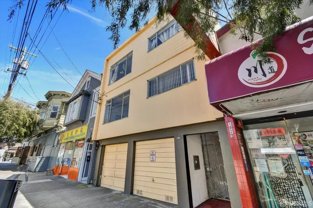 a view of a street with stores