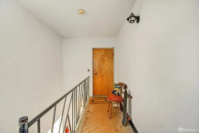 a view of a hallway with a staircase