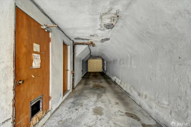 a view of a hallway with stairs