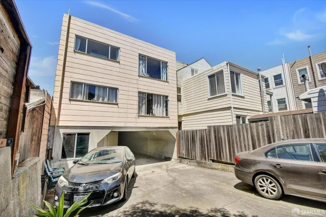 a view of a car in front of a house