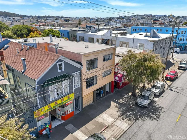 an aerial view of a house with a garden