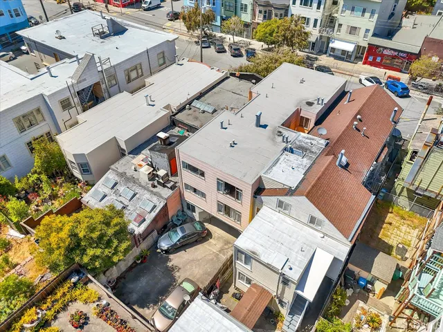 an aerial view of a city with lots of residential buildings