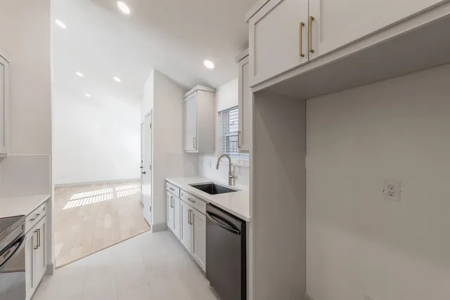 a view of an empty room with fire place and a fireplace