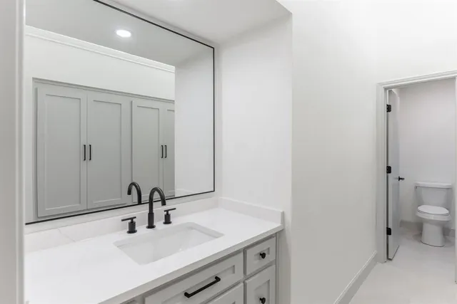 a bathroom with a sink and mirror