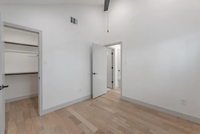 a view of a house with a yard and plants