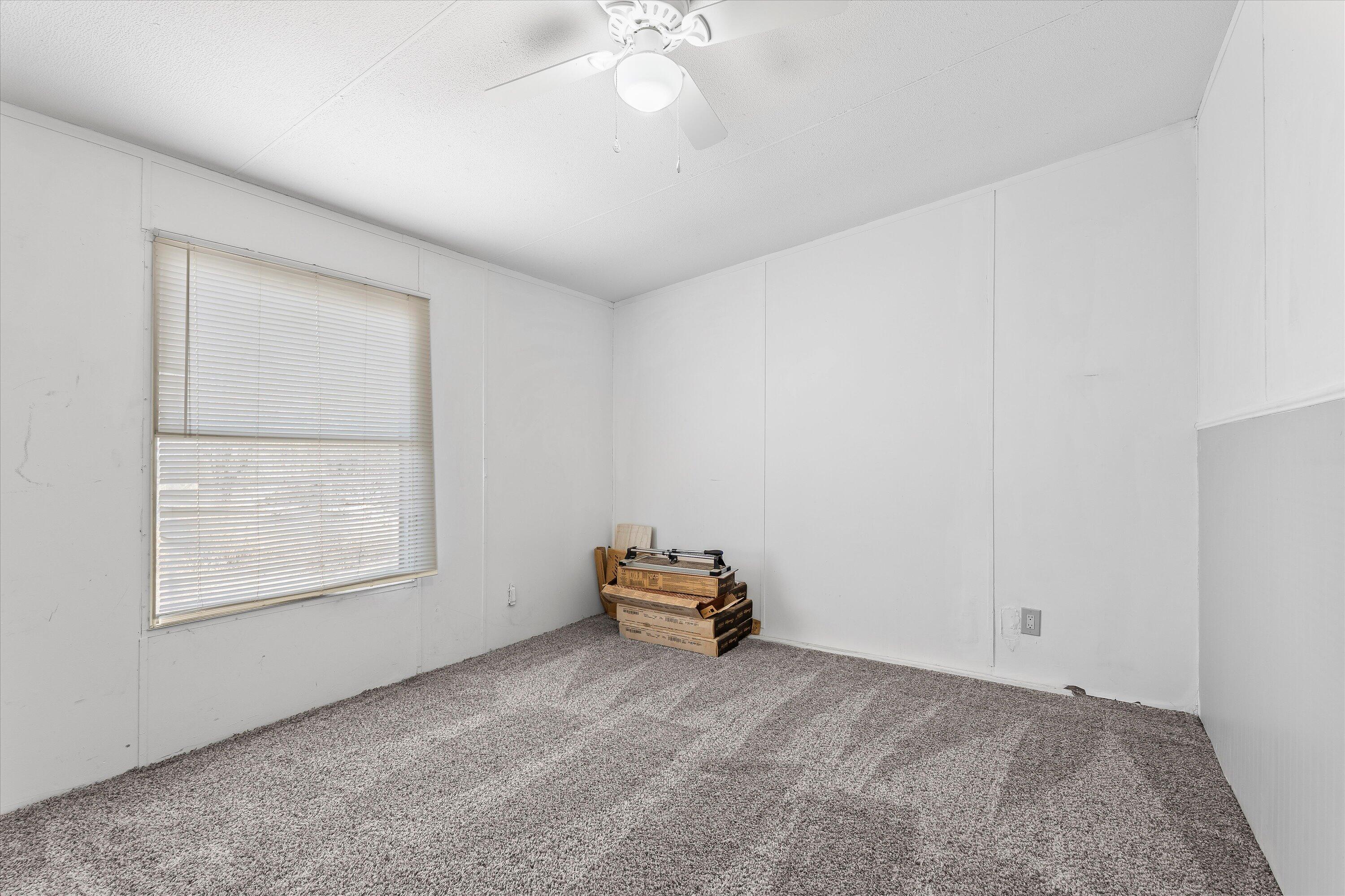 9909 North Chester Avenue Lubbock, TX 79415 - Photo 19 of 24 a hallway with a window