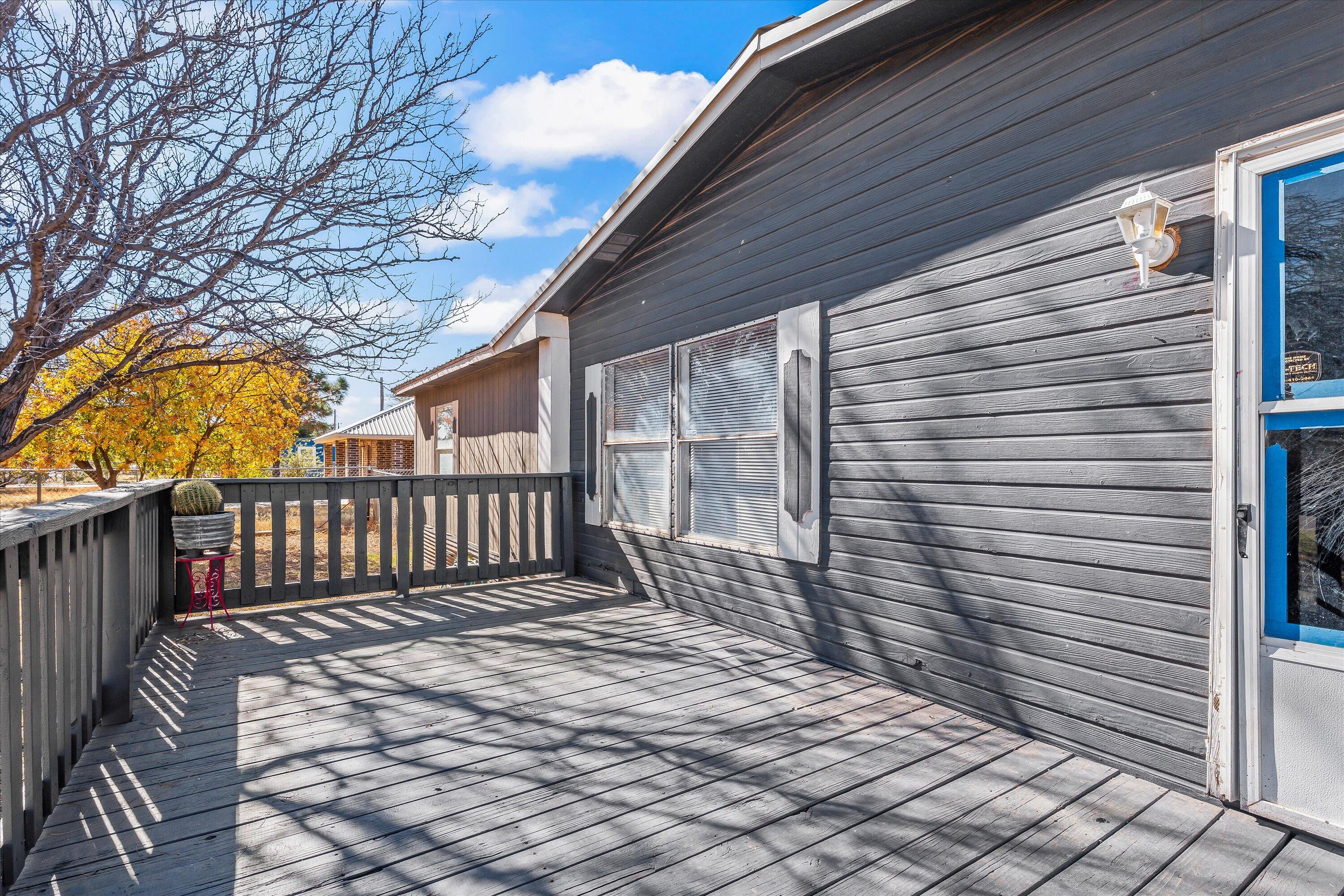 9909 North Chester Avenue Lubbock, TX 79415 - Photo 4 of 24 a view of balcony with wooden floor