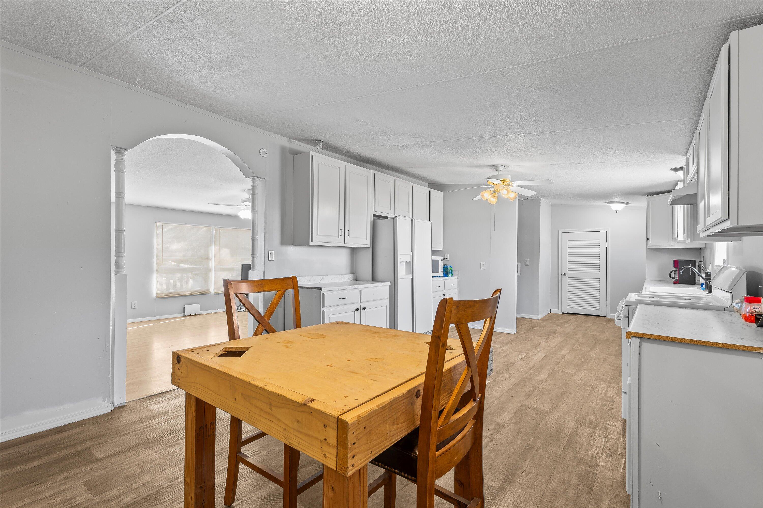 9909 North Chester Avenue Lubbock, TX 79415 - Photo 10 of 24 a view of a dining room with furniture