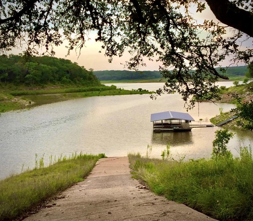 26809 Blue Cove Road Marble Falls, TX 78654 - Photo 4 of 15 a view of a lake with houses in outdoor space