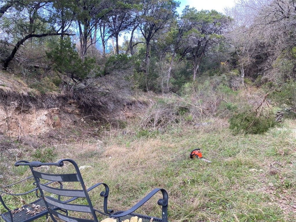 26809 Blue Cove Road Marble Falls, TX 78654 - Photo 9 of 15 a backyard of a house with table and chairs