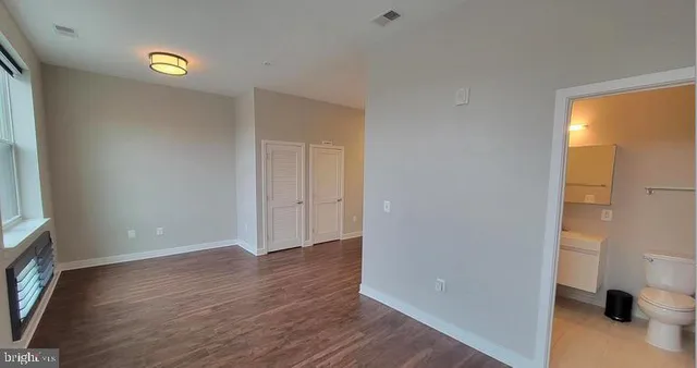 an entryway with a bench in balcony