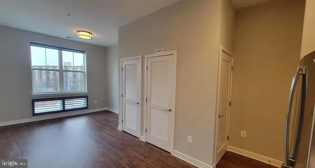 a bathroom with a shower and a glass door