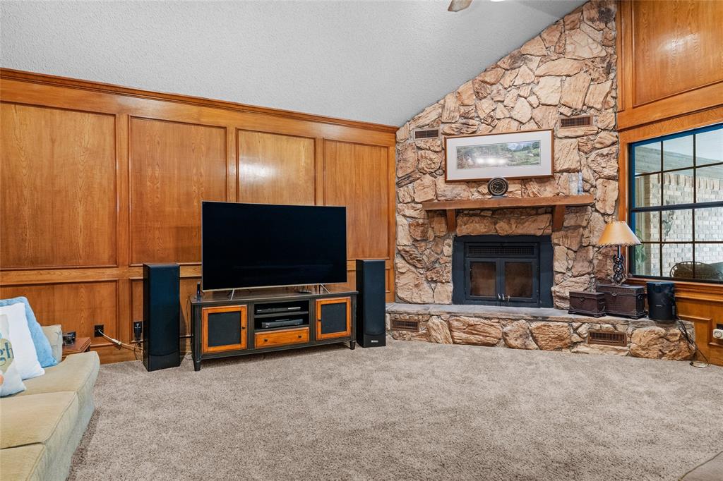 5840 Crystal Drive Midlothian, TX 76065 - Photo 7 of 36 a living room with furniture a flat screen tv and a fireplace