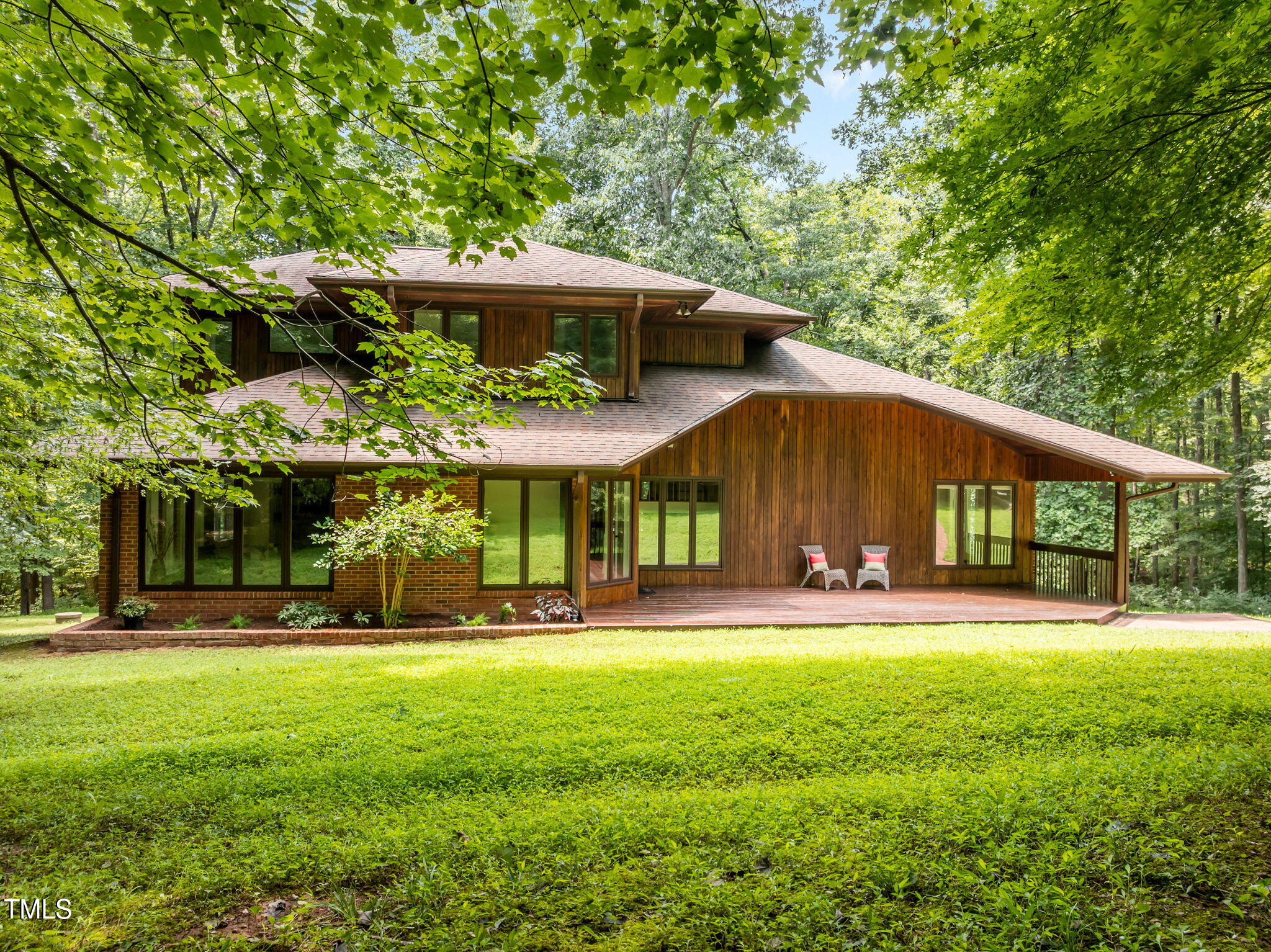 801 Creekstone Drive Chapel Hill, NC 27516 - Photo 1 of 65 a front view of a house with a yard