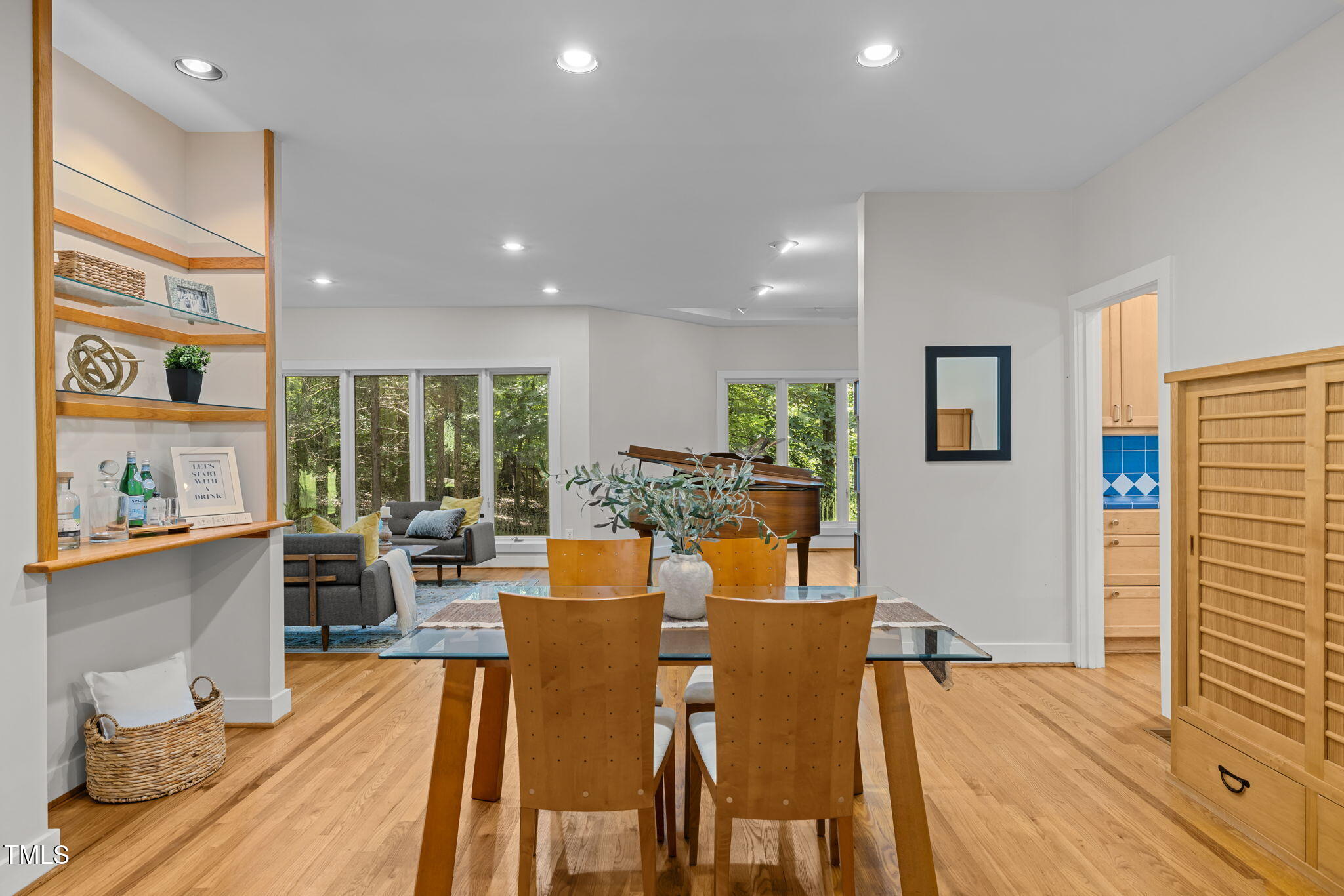 801 Creekstone Drive Chapel Hill, NC 27516 - Photo 9 of 65 a view of a dining room with furniture window and wooden floor
