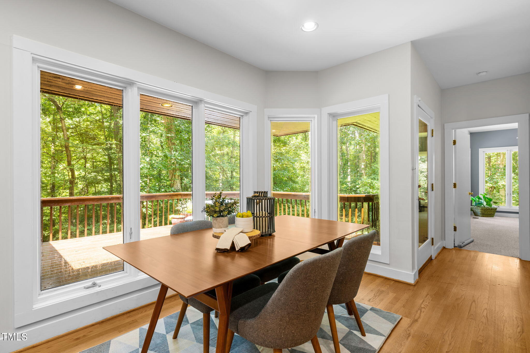 801 Creekstone Drive Chapel Hill, NC 27516 - Photo 15 of 65 a view of a dining room with furniture and wooden floor