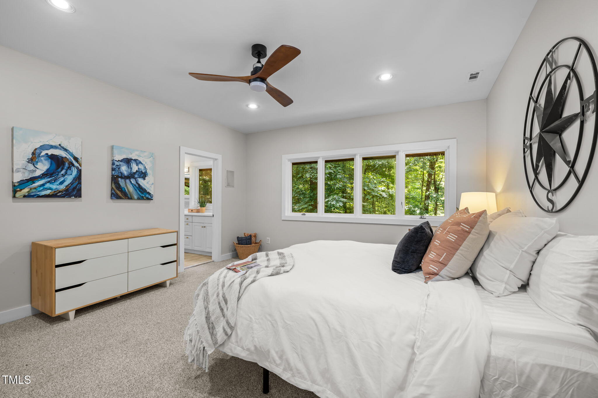 801 Creekstone Drive Chapel Hill, NC 27516 - Photo 17 of 65 a bedroom with a bed and a window