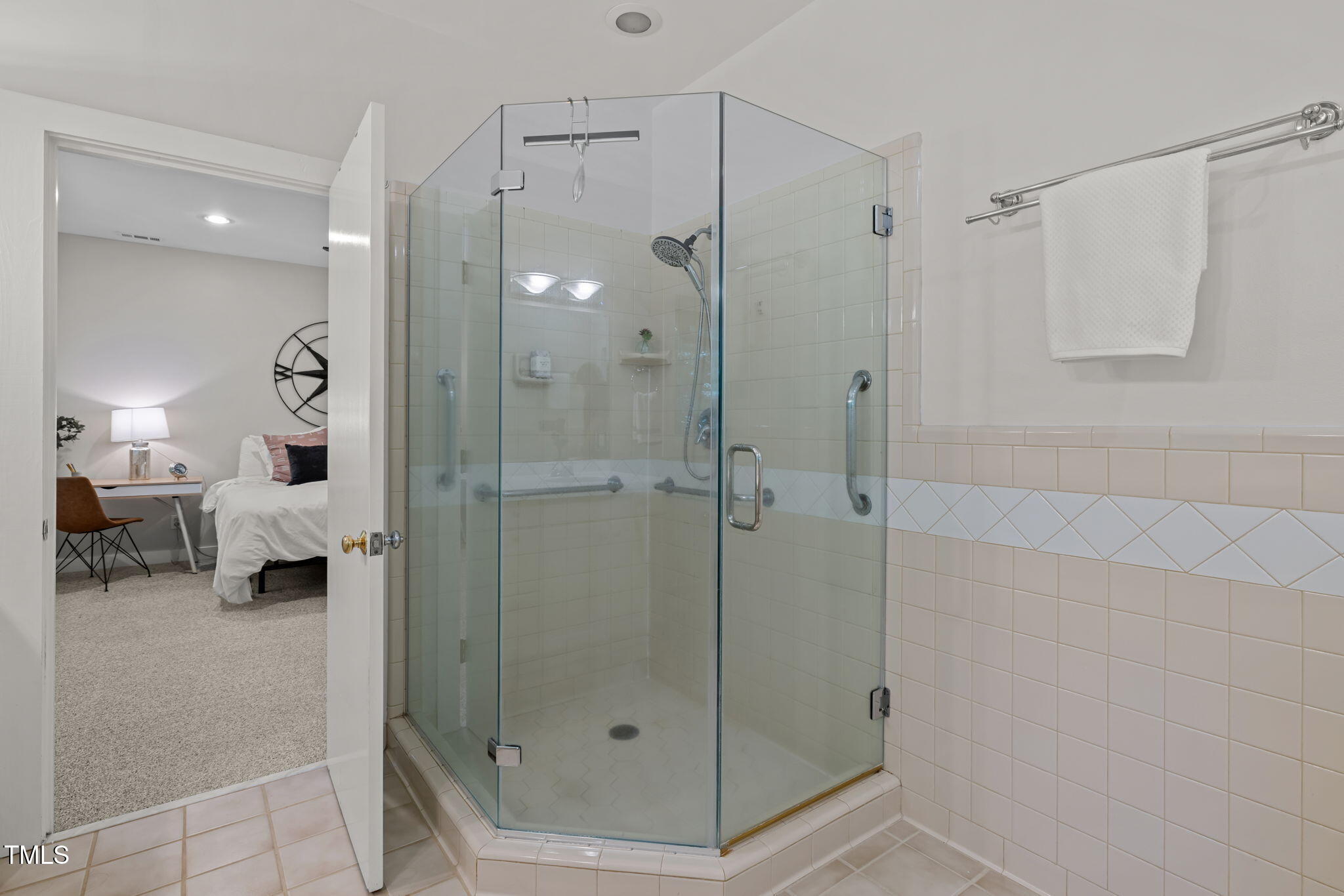 801 Creekstone Drive Chapel Hill, NC 27516 - Photo 20 of 65 a bathroom with a shower and a glass door