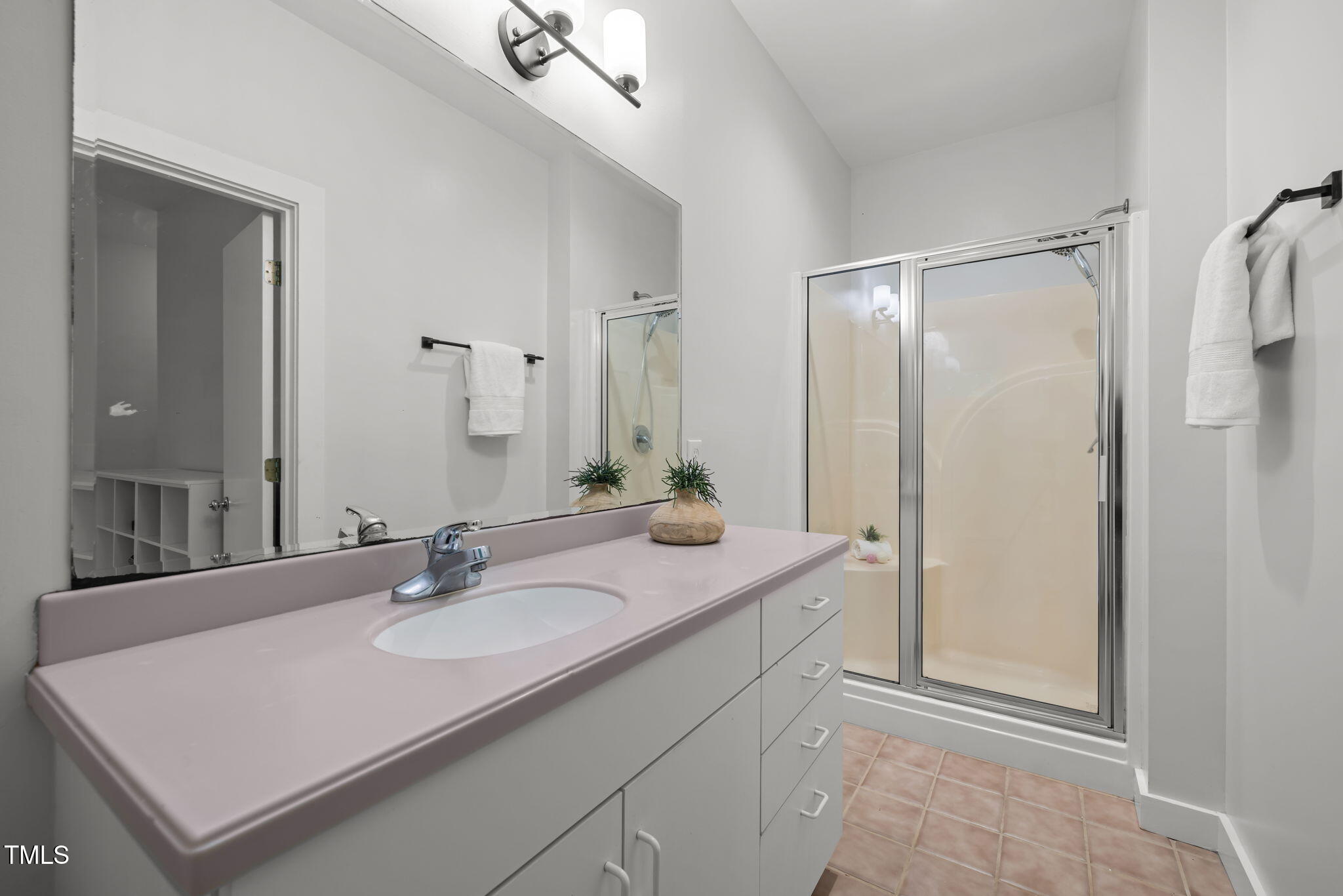 801 Creekstone Drive Chapel Hill, NC 27516 - Photo 24 of 65 a bathroom with a sink double vanity and a mirror