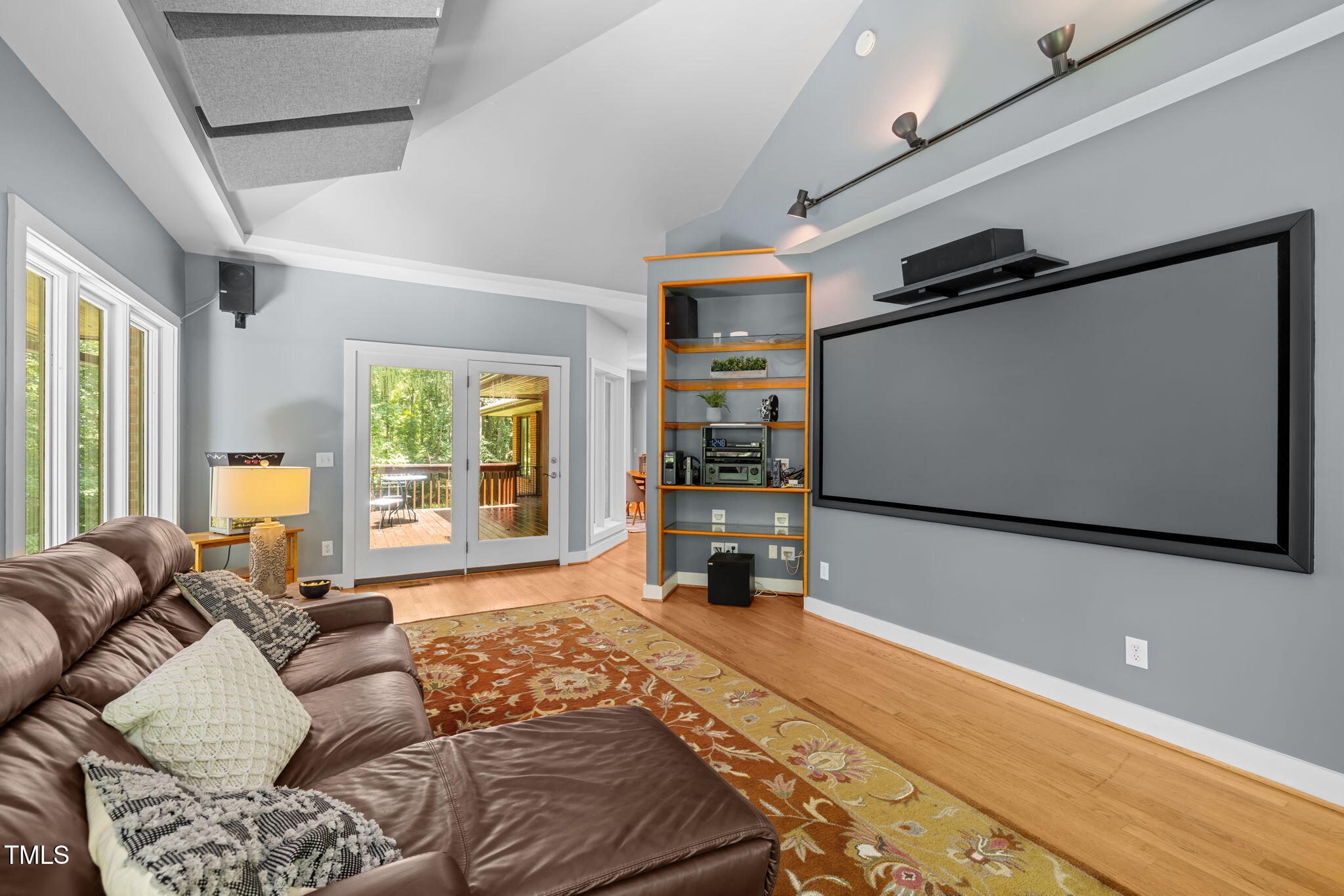 801 Creekstone Drive Chapel Hill, NC 27516 - Photo 25 of 65 a living room with furniture and a flat screen tv