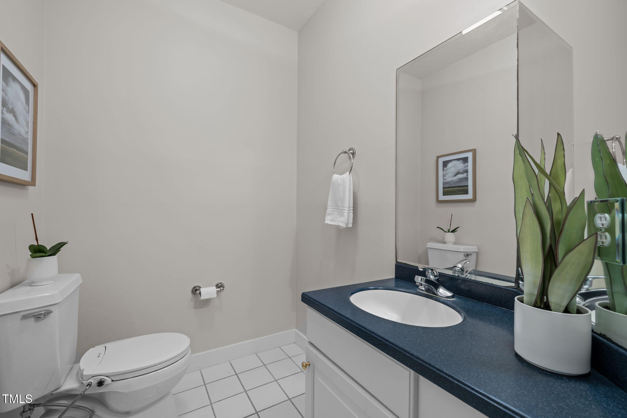 801 Creekstone Drive Chapel Hill, NC 27516 - Photo 27 of 65 a bathroom with a granite countertop toilet sink and mirror