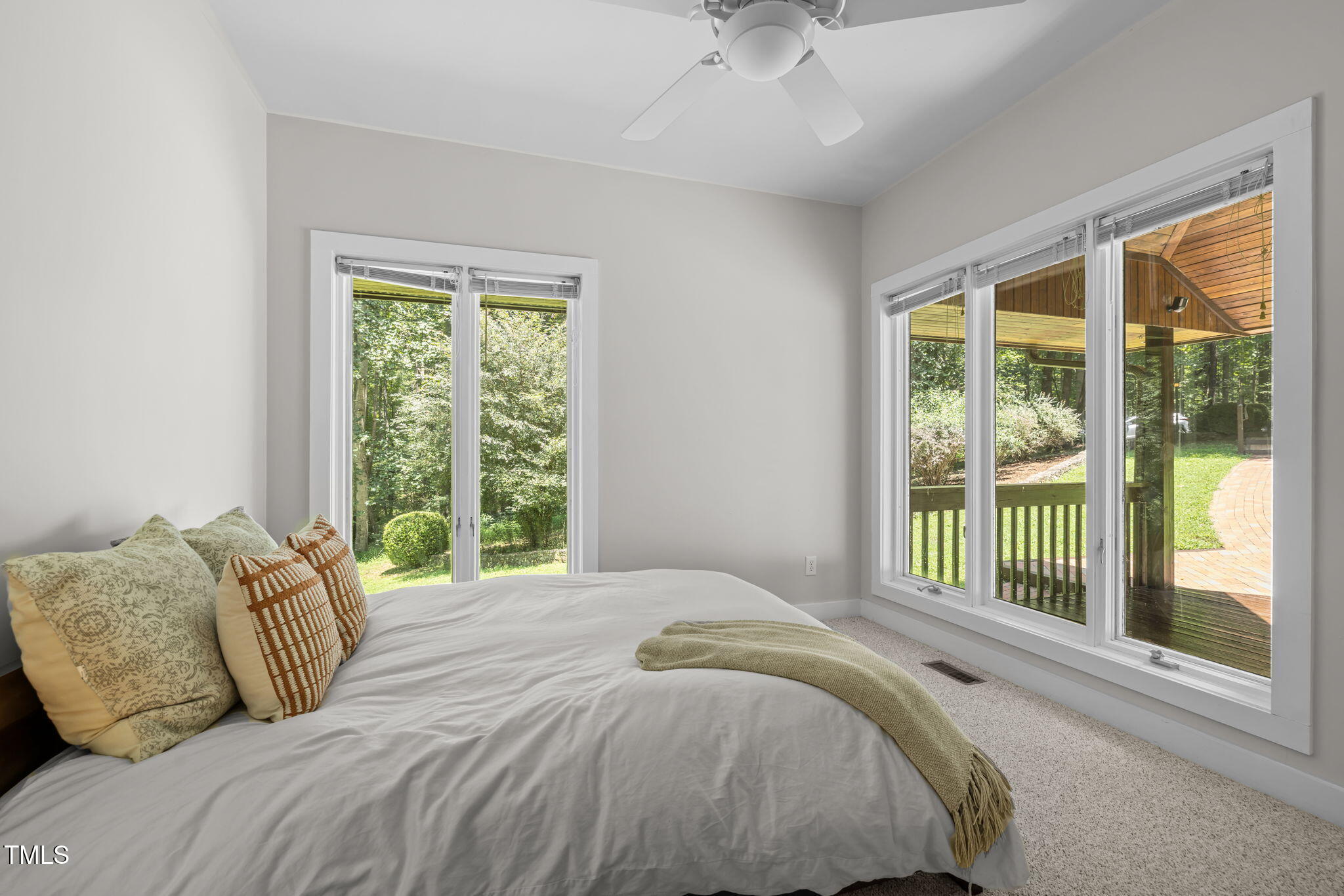 801 Creekstone Drive Chapel Hill, NC 27516 - Photo 28 of 65 a bedroom with a large bed and a large window