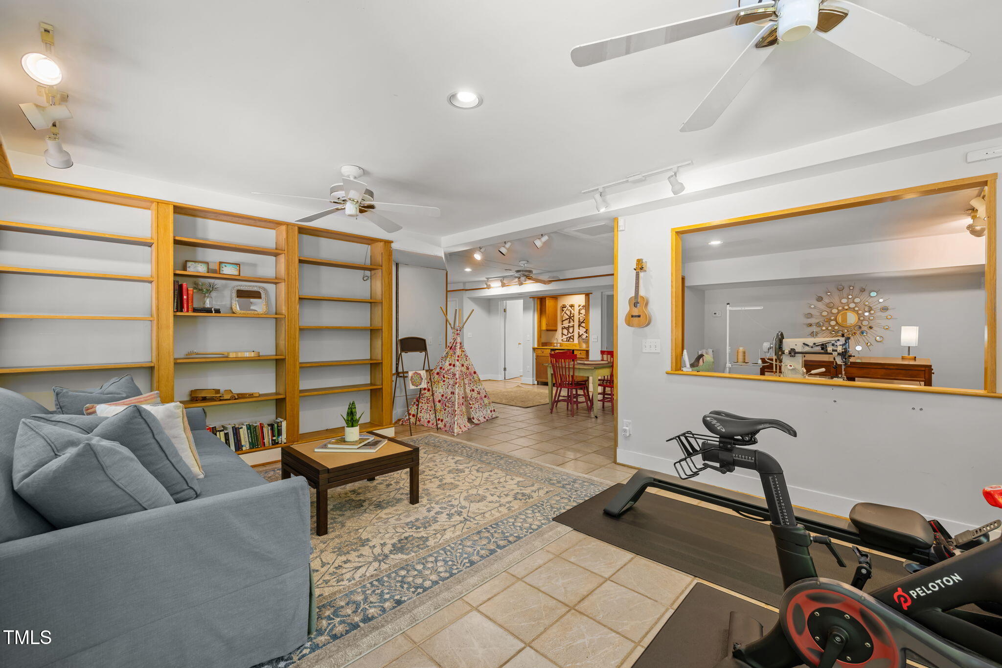 801 Creekstone Drive Chapel Hill, NC 27516 - Photo 36 of 65 a living room with furniture a rug and white walls