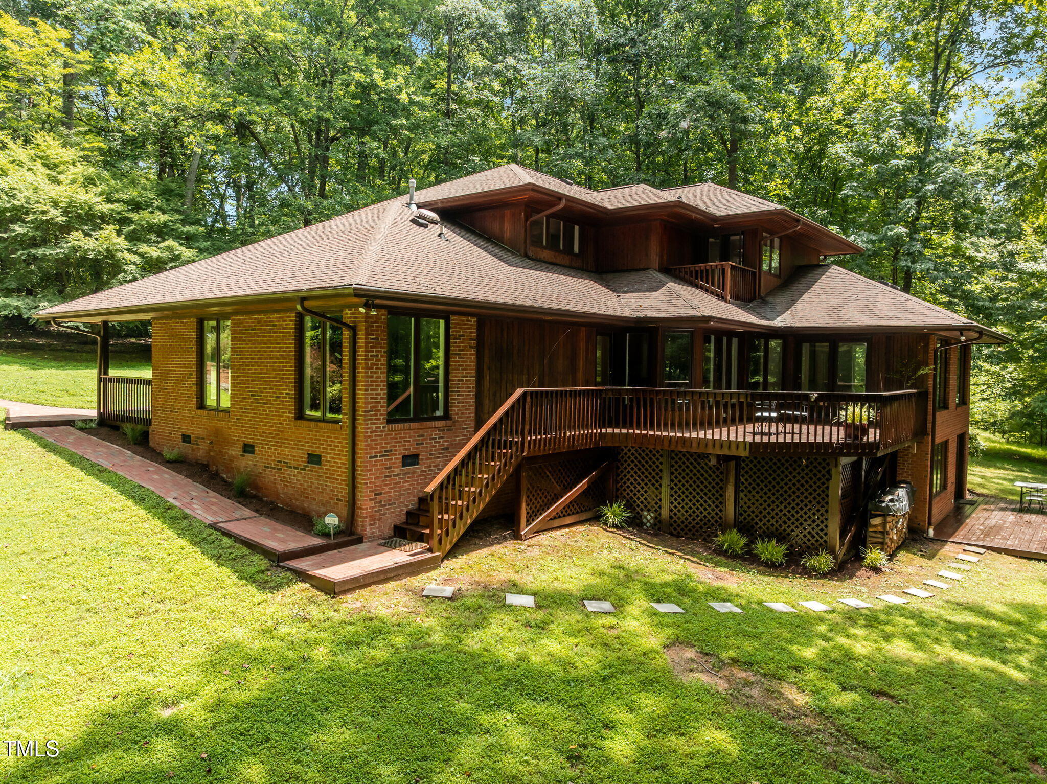 801 Creekstone Drive Chapel Hill, NC 27516 - Photo 38 of 65 a front view of a house with yard and trees