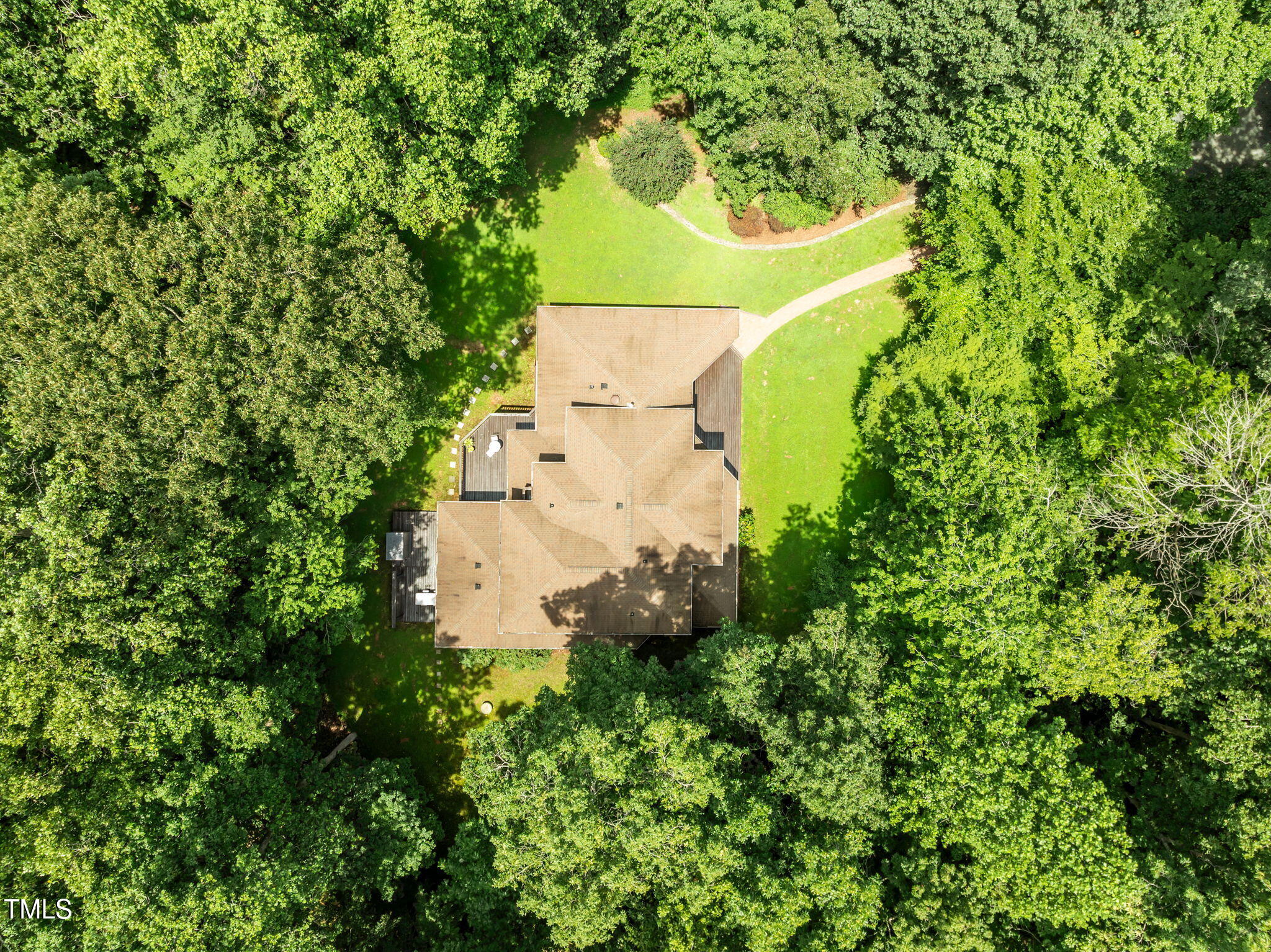 801 Creekstone Drive Chapel Hill, NC 27516 - Photo 39 of 65 an aerial view of a house with a yard and trees