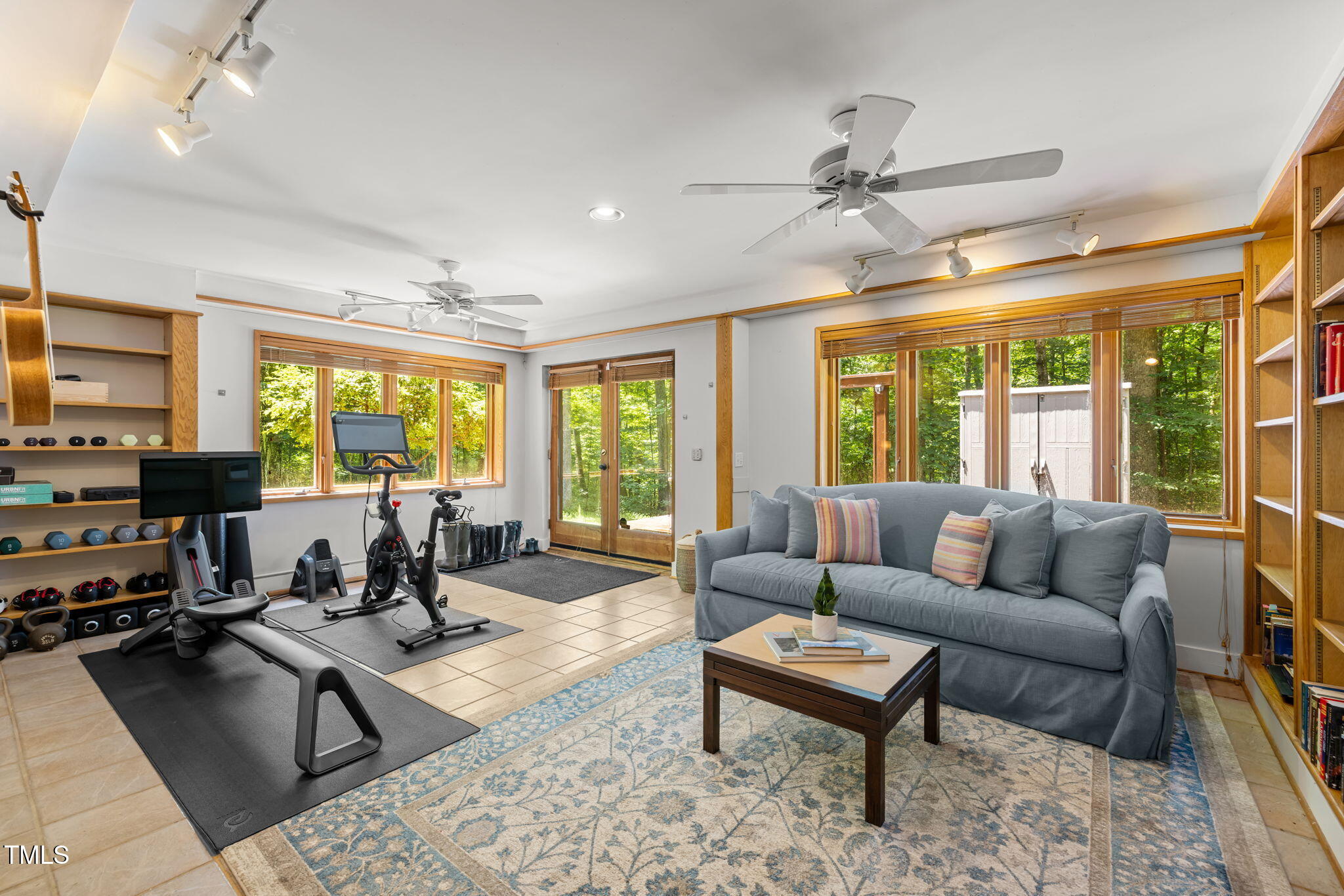 801 Creekstone Drive Chapel Hill, NC 27516 - Photo 43 of 65 a living room with furniture a large window and a table