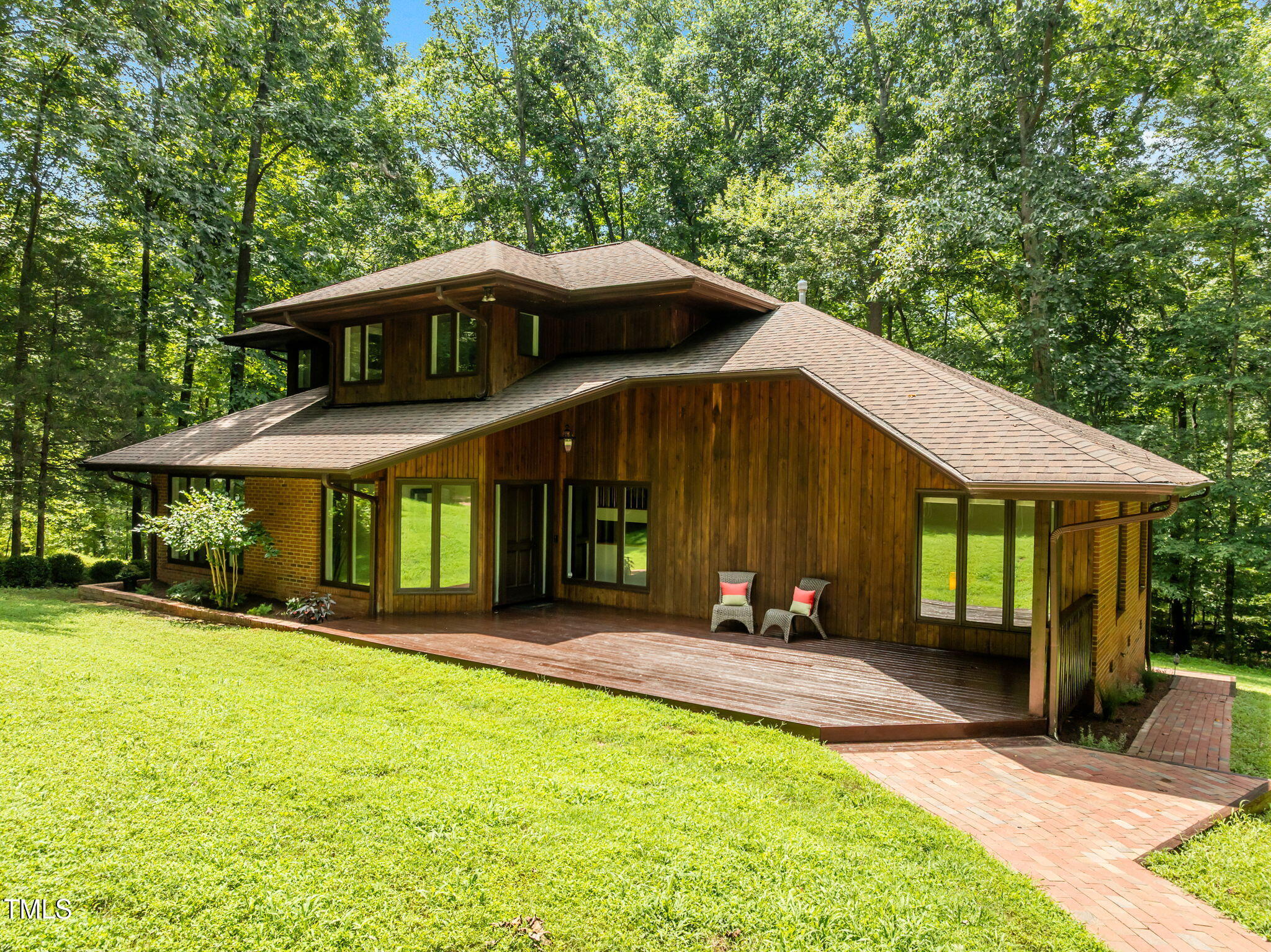 801 Creekstone Drive Chapel Hill, NC 27516 - Photo 3 of 65 a front view of a house with a yard table and chairs
