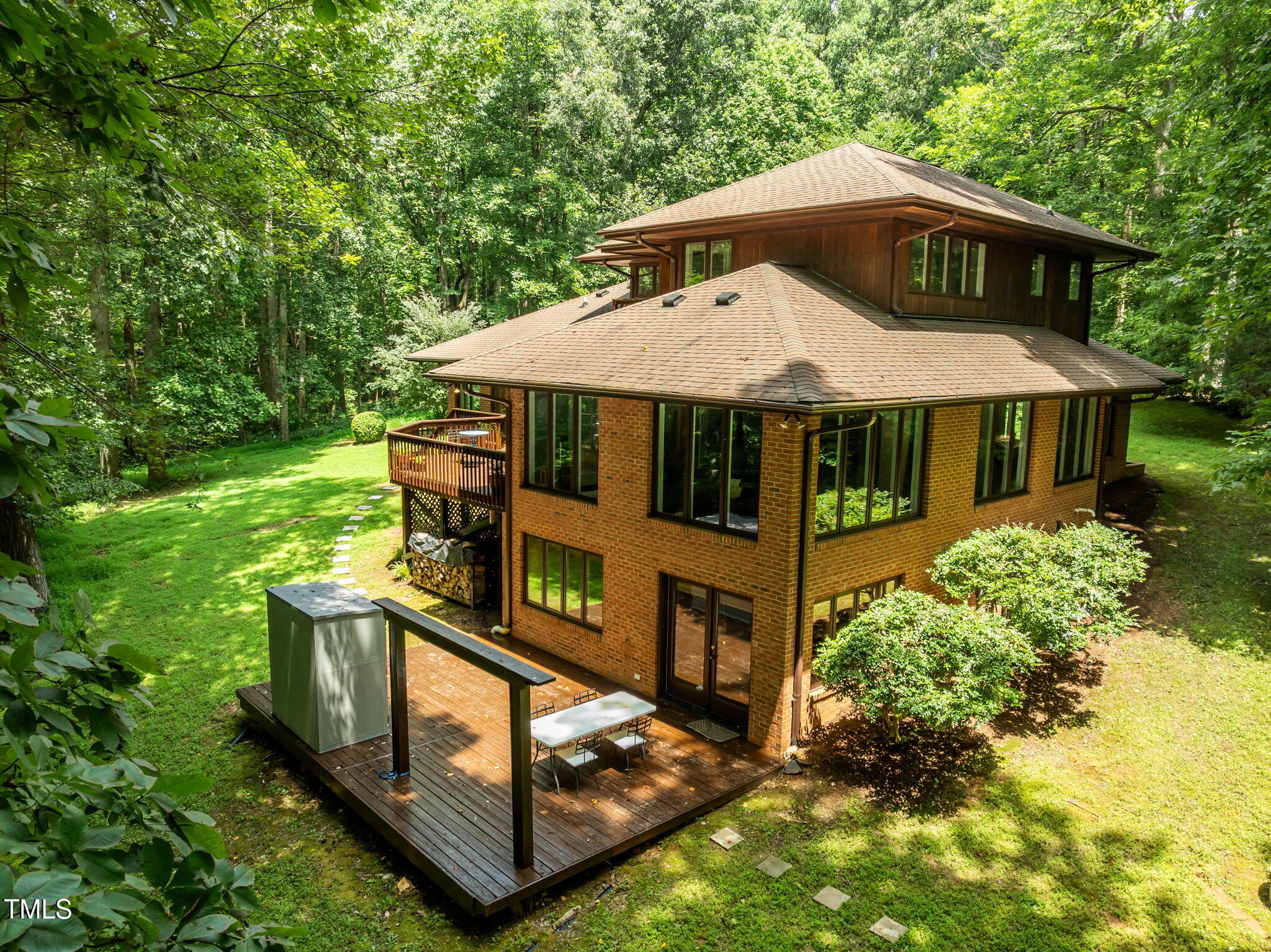801 Creekstone Drive Chapel Hill, NC 27516 - Photo 48 of 65 a front view of a house with yard plants and large trees
