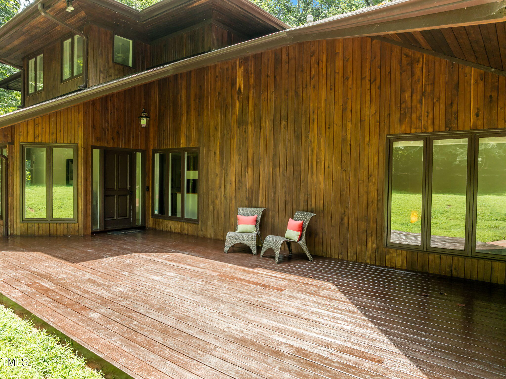 801 Creekstone Drive Chapel Hill, NC 27516 - Photo 49 of 65 a view of a patio with table and chairs with wooden floor and fence