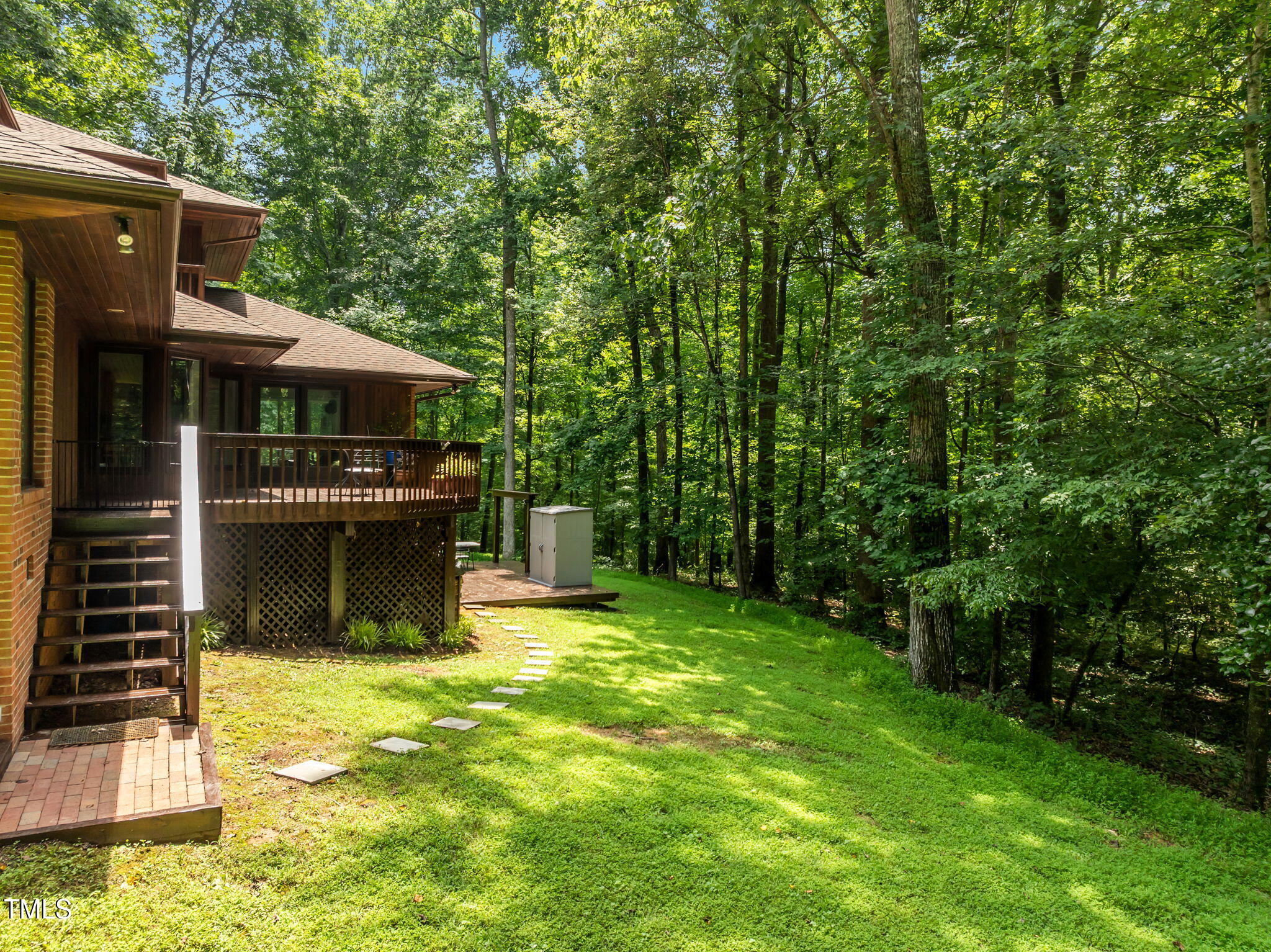 801 Creekstone Drive Chapel Hill, NC 27516 - Photo 50 of 65 a view of a house with a yard