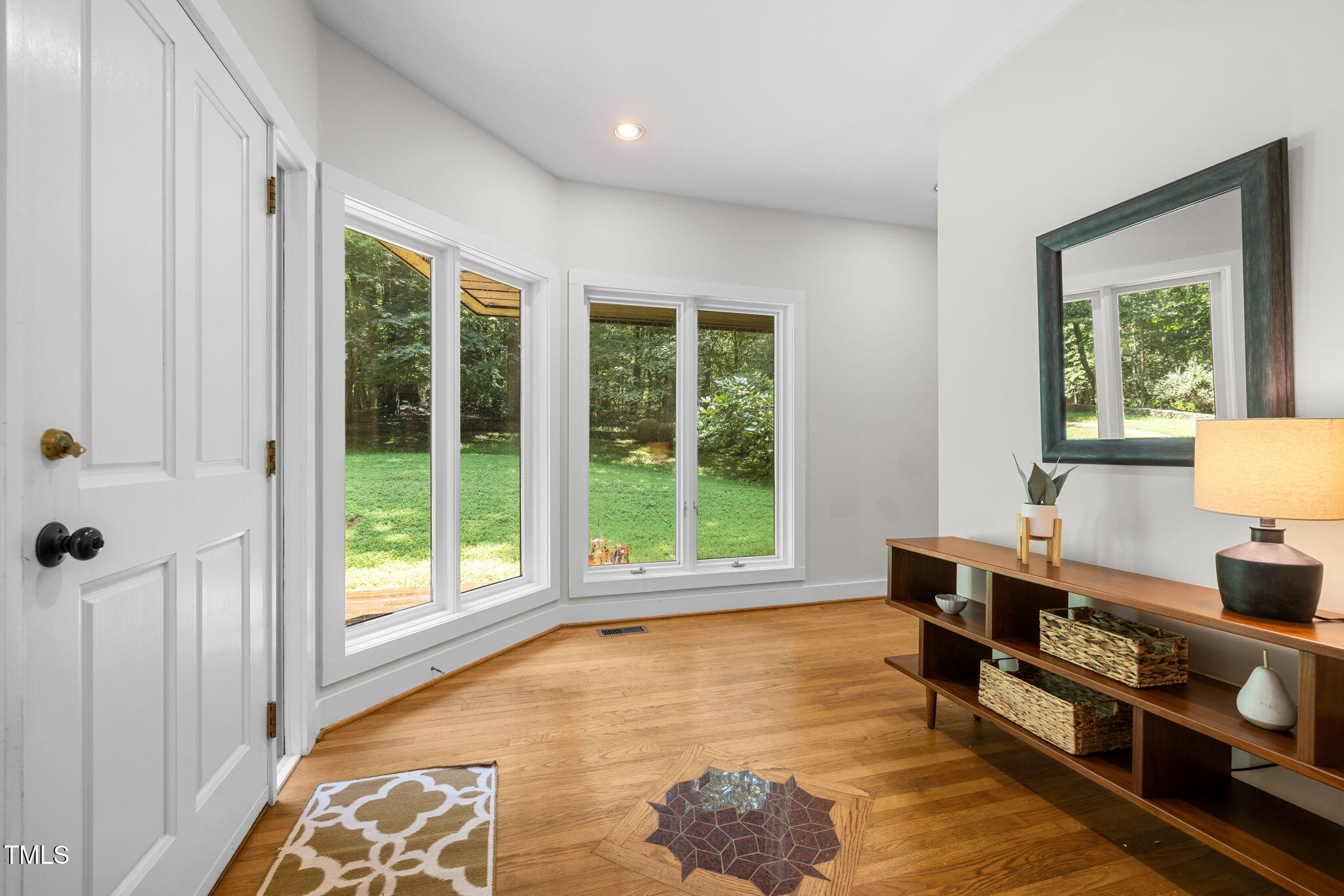 801 Creekstone Drive Chapel Hill, NC 27516 - Photo 4 of 65 a spacious bedroom with a bed and a window