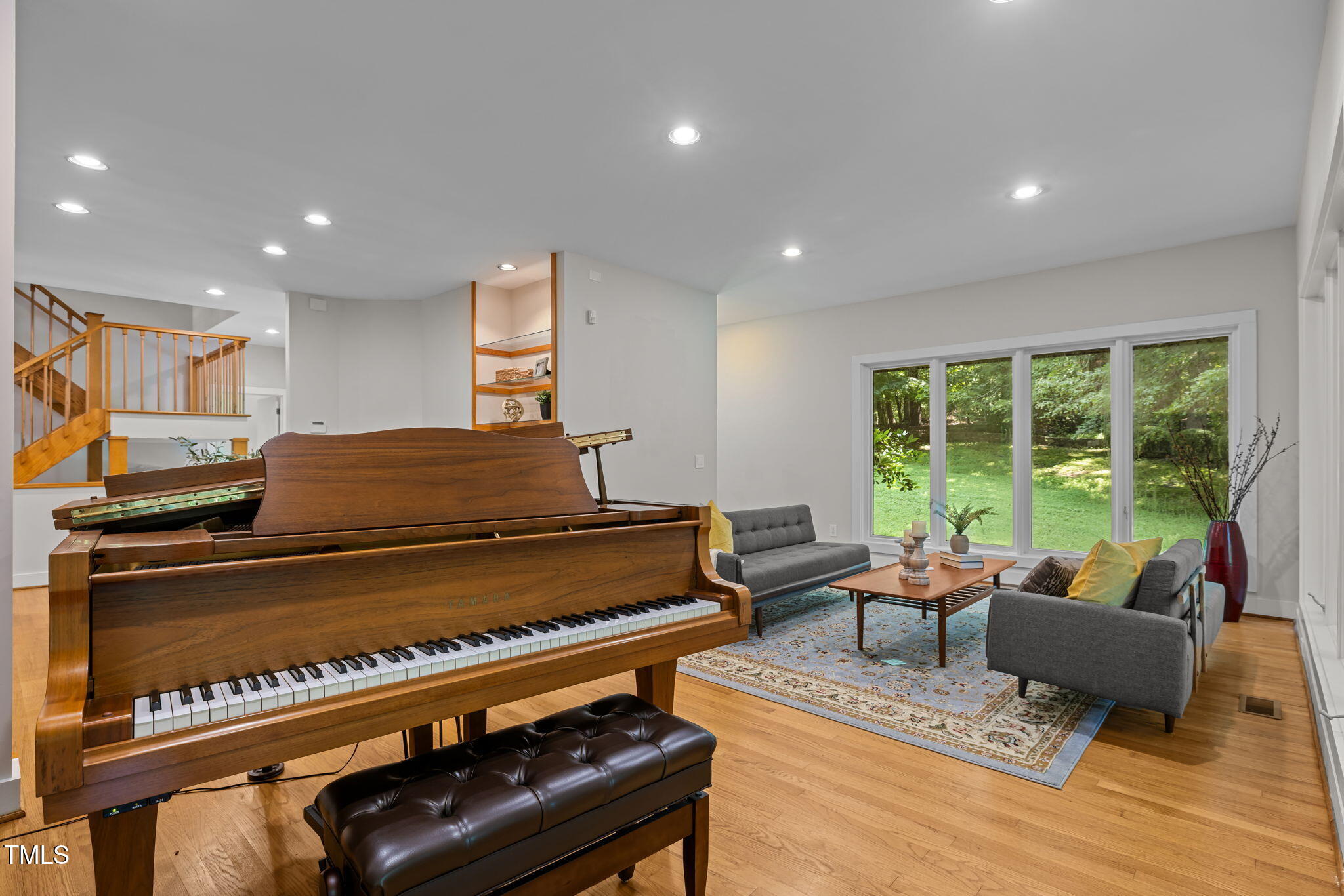 801 Creekstone Drive Chapel Hill, NC 27516 - Photo 6 of 65 a living room with furniture and a piano