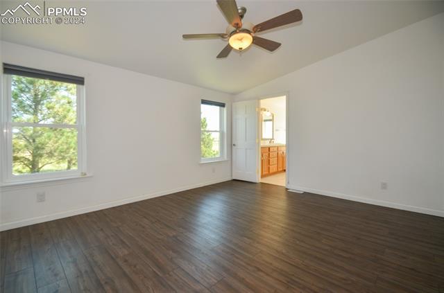 34115 Big Springs Road Yoder, CO 80864 - Photo 17 of 35 Empty room with dark wood-type flooring, vaulted ceiling, ceiling fan, and sink