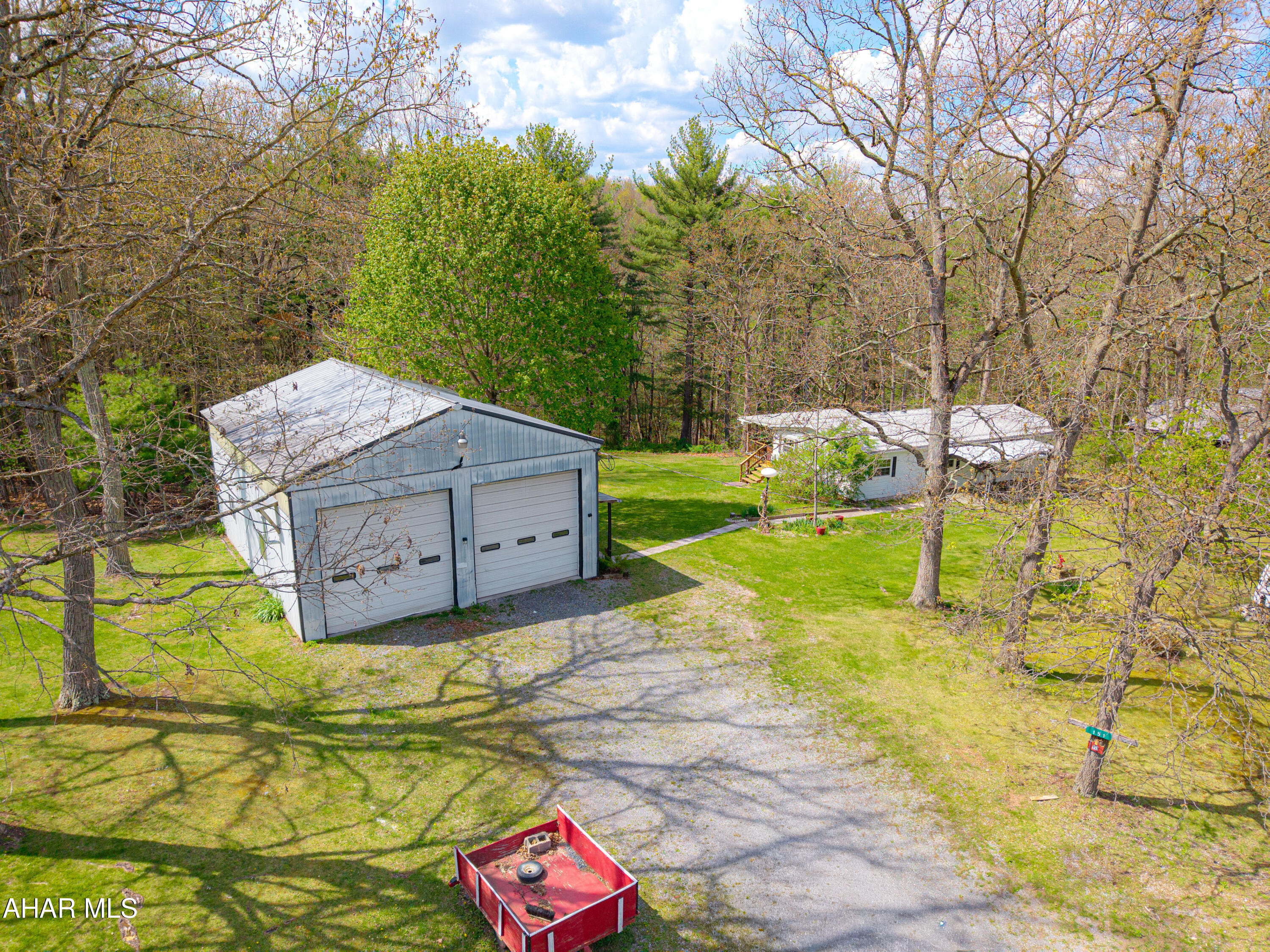 151 Pine Echo Road Everett, PA 15537 - Photo 41 of 51 a backyard of a house with table and chairs