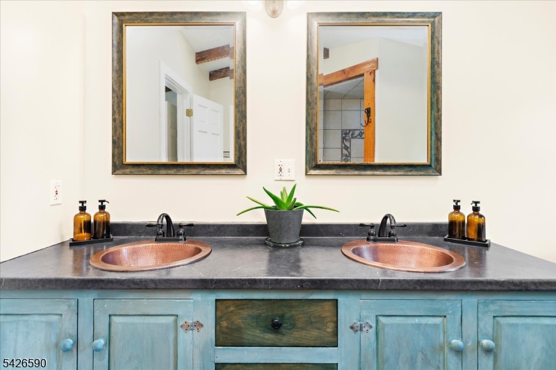 179 Lindbergh Road Hopewell, NJ 08525 - Photo 22 of 46 a bathroom with sink and mirror