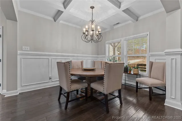 a kitchen with stainless steel appliances granite countertop a sink a stove top oven a counter space and living room view