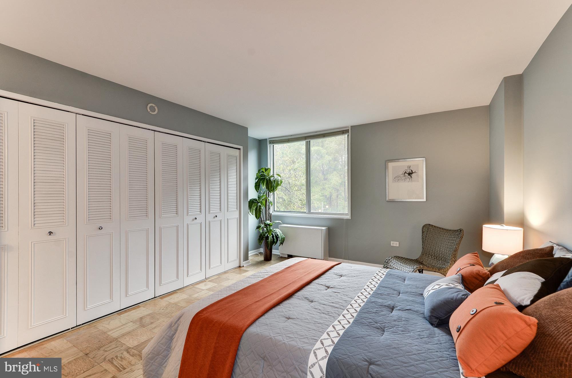 2939 Van Ness Street Northwest, Unit 216 Washington, DC 20008 - Photo 6 of 20 a bedroom with a bed and window