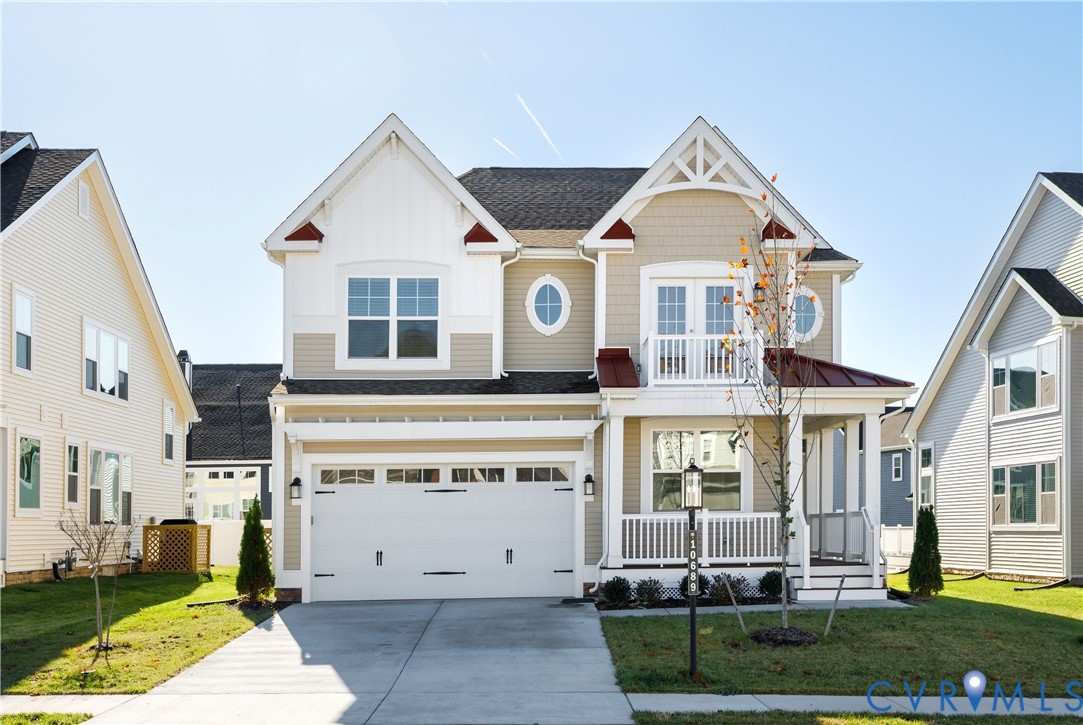 a view of a white house with a big yard and large windows