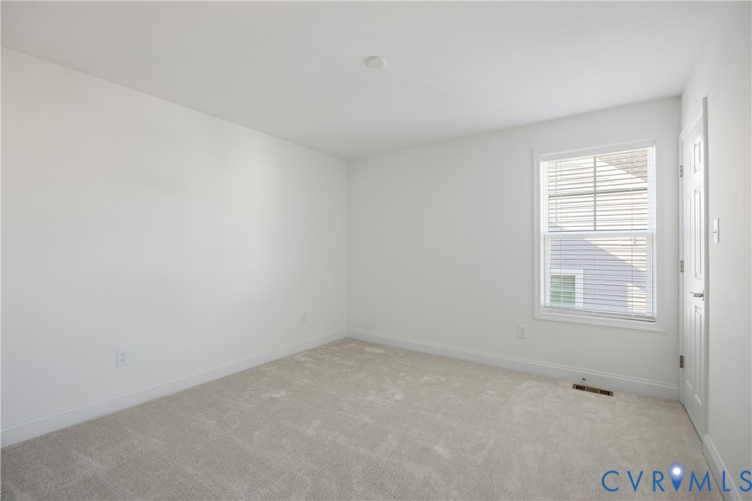 10689 Fern Basket Road Glen Allen, VA 23059 - Photo 28 of 50 an empty room with a window