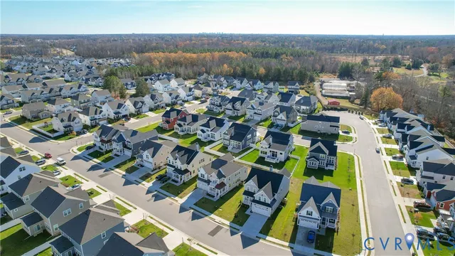 an aerial view of houses with swimming pool